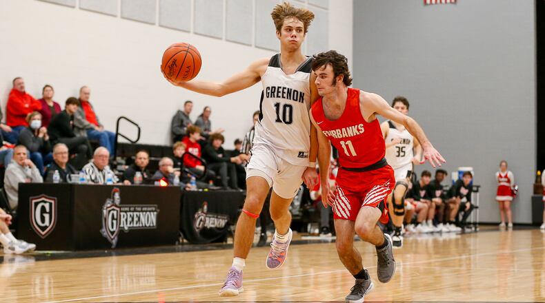 Cutline 1: Greenon High School senior Jaden Journell passes the ball to a teammate while being guarded by Fairbanks senior Dylan Tobe during their game on Tuesday, Jan. 4 in Enon. The Knights won 50-40. CONTRIBUTED PHOTO BY MICHAEL COOPER