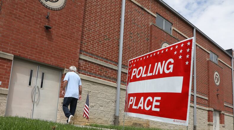 A voter walks into the New Carlisle polling place at Tecumseh High School Tuesday. BILL LACKEY/STAFF