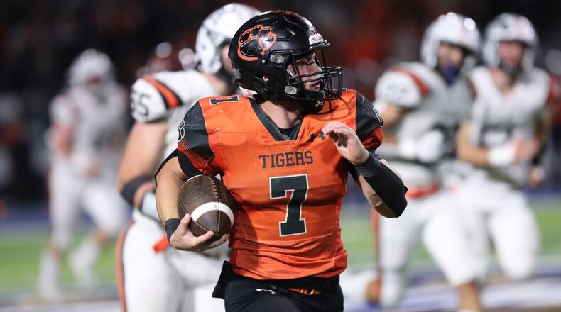 West Liberty-Salem senior Josh Wilcoxon runs the ball during their game against Waynesville on Friday night at Dayton Welcome Stadium. The Tigers won 45-42. Michael Cooper/CONTRIBUTED
