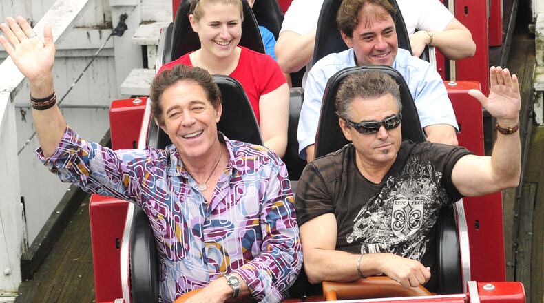 Cast members of the 70's TV Show "The Brady Bunch" reunited at Kings Island Sunday, May 19, 2013. Barry Williams (Greg Brady) and Christopher Knight (Peter Brady) share the front row of the Racer roller coaster for their second ride of the day. The reunion with Barry, Christopher and Susan Olsen (not pictured) marked forty years since the Kings Island Brady Bunch episode aired. The three spent the morning talking with media and radio winners before heading to do three shows for guest of the park. (CONTRIBUTED BY MARTIN WHEELER)