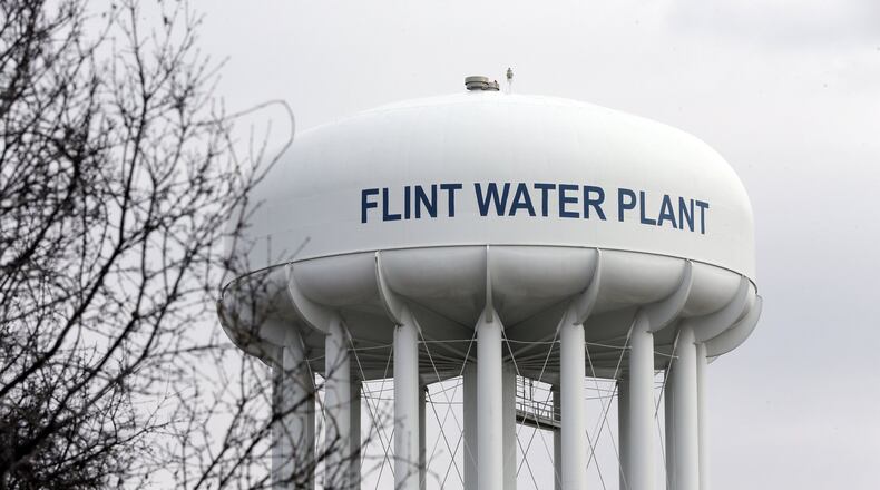 The Flint Water Plant tower is seen in Flint, Mich. Michigan Gov. Rick Snyder on Thursday, March 10, released another 4,400 pages of his executive office’s emails and documents related to the lead-contaminated water in Flint. The disclosure is the third voluntary release of such records, which have revealed his administration’s inner dialogue before the crisis and as it grew after the financially struggling city left Detroit’s water system and started using the Flint River to save money. (AP Photo/Carlos Osorio, FILE)