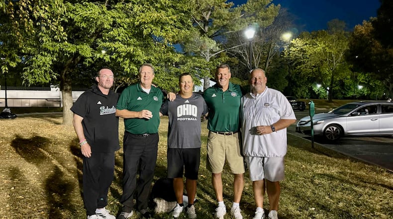 Former Wittenberg football coach Joe Fincham, second from right, poses for a photo with (left to right) John Hauser, Marty Bannister, Scott Isphording and Chris Woods in Athens in September 2025. Hauser played at Wittenberg and coaches at Ohio with Isphording and Woods, who coached with Fincham at Wittenberg. Bannister, a former play-by-play broadcaster at Wittenberg, calls games on radio for Ohio. Contributed photo