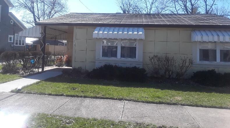 The steel house at 219 S. Cherry St. in Germantown is for sale. The  Lustron home  is maize yellow.