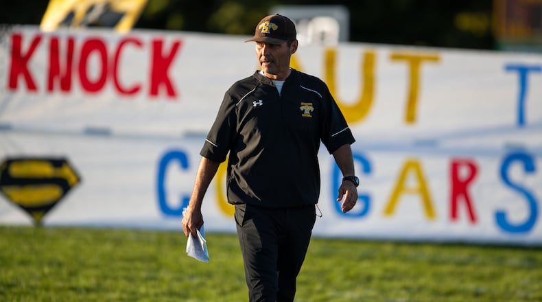 Shawnee High School football coach Rick Meeks walks out onto the field before their game against Kenton Ridge on Sept. 15, 2023. Meeks has stepped down after 22 years as Shawnee head coach. Michael Cooper/CONTRIBUTED