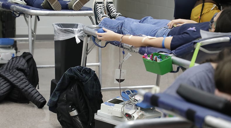 The Community Blood Center is hosting several drives this month to help with the blood shortage. Here, students and staff at Springfield High School held a blood drive for the Community Blood Center where they had 80 donors give blood. BILL LACKEY/STAFF