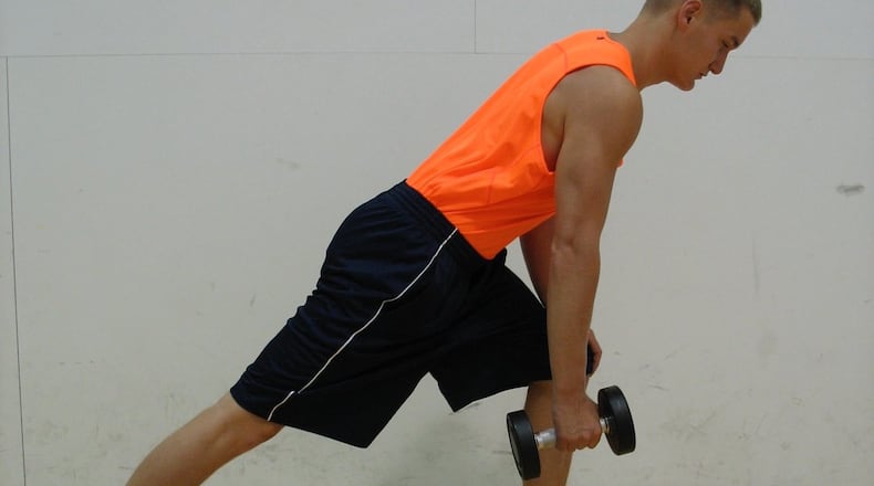 Hold dumbbell in right hand, other hand on left knee. CONTRIBUTED