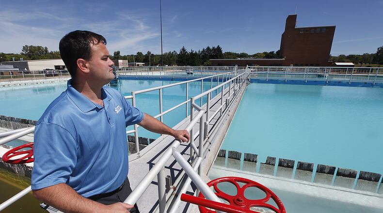 Allen Jones looks over the water being treated at the Springfield Water Treatment Plant on Eagle City Road in 2013. Bill Lackey/Staff