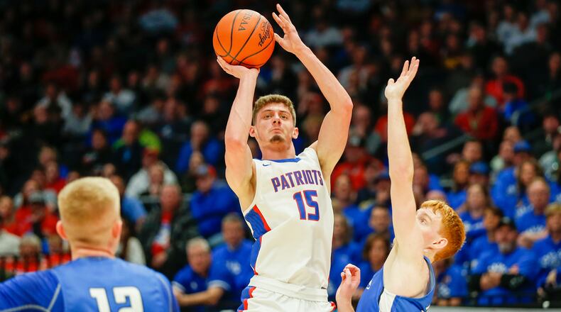 Cutline: Tri-Village High School senior Layne Sarver shoots the ball over Antwerp's Landon Brewer during their Division IV state semifinal game on Saturday afternoon at UD Arena. Michael Cooper/CONTRIBUTED