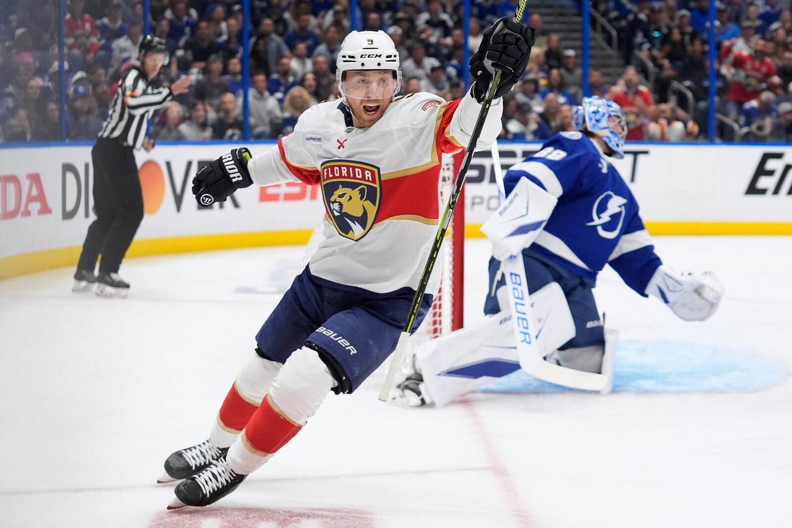 Florida Panthers center Sam Bennett (9) celebrates after scoring past Tampa Bay Lightning goaltender Andrei Vasilevskiy (88) during the first period in Game 1 of an NHL hockey Stanley Cup first-round playoff series, Tuesday, April 22, 2025, in Tampa, Fla. (AP Photo/Chris O'Meara)