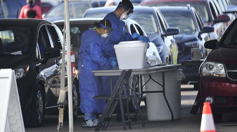 People lined up Thursday to takes advantage of the free testing for the Coronavirus at the Five Rivers Health Centers pop up test site at the Samaritan Health Center. MARSHALL GORBYSTAFF