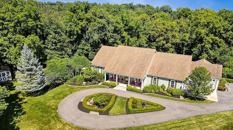The 4-bedroom, Cape Cod-style home has about 3,580 sq. ft. of living space with an attached, 4-car garage and a 4-season room. CONTRIBUTED PHOTO
