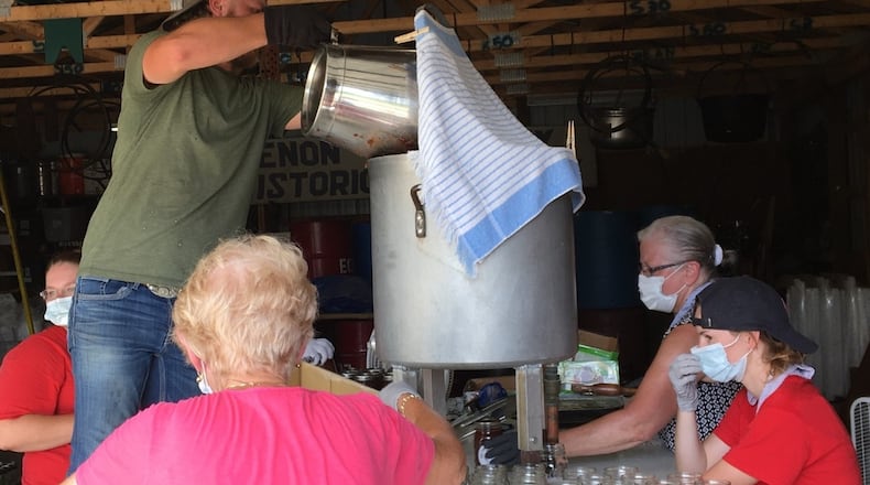 Pictured is the process of canning apple butter ahead of the Enon Apple Butter Festival, which will be held 10 a.m. to 6 p.m. Saturday, Oct. 11, and 11 a.m. to 5 p.m. Sunday, Oct. 12, in Enon in the area of South Xenia Street and the grounds of Enon Elementary School, 120 South Xenia Dr. CONTRIBUTED