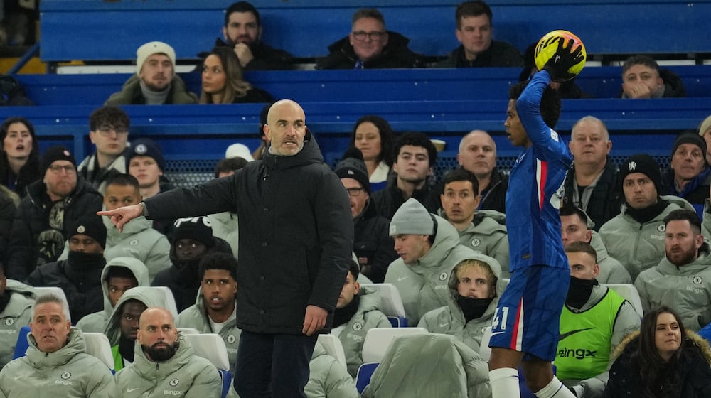 Chelsea's head coach Enzo Maresca, left, gives instructions to Estevao during the English Premier League soccer match between Chelsea and Bournemouth in London, England, Tuesday, Dec. 30, 2025. (AP Photo/Kin Cheung)