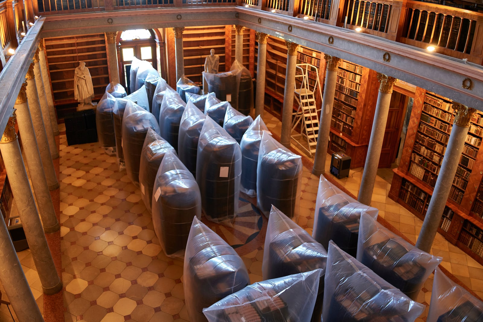 Books are kept in hermetically sealed plastic sacks for disinfection, at the Pannonhalma Archabbey's library in Pannonhalma, Hungary, Thursday, July 3, 2025, as a beetle infestation threatens its ancient collection. (AP Photo/Bela Szandelszky)