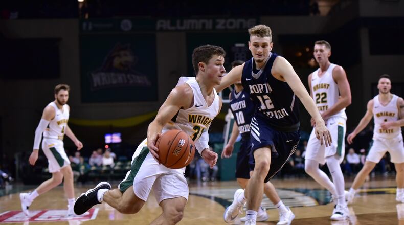 Wright State point guard Cole Gentry looks to drive past North Florida’s Ryan Burkhardt during Saturday’s game at the Nutter Center. Joseph Craven/CONTRIBUTED