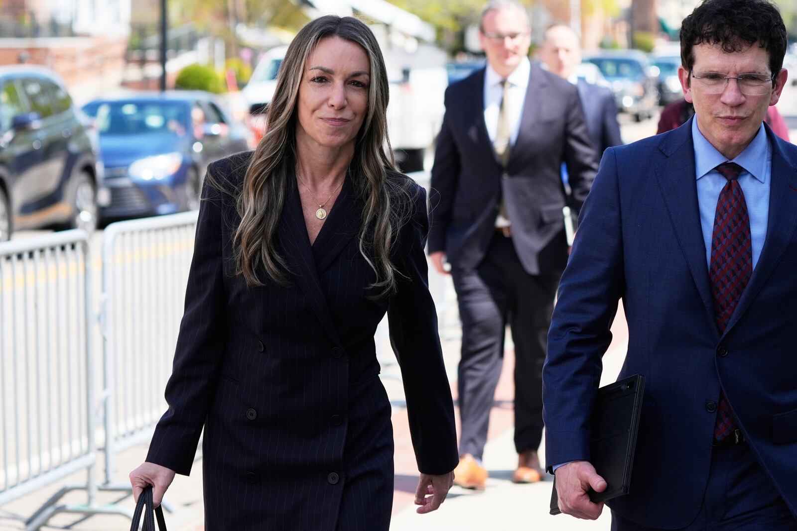 Karen Read, left, returns to court following the lunch break with her defense attorney Robert Alessi at her trial at Norfolk Superior Court, Tuesday, April 22, 2025, in Dedham, Mass. (AP Photo/Charles Krupa)