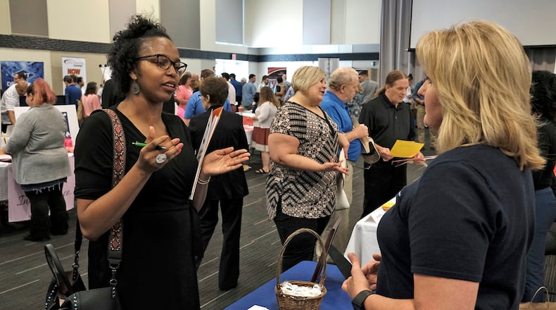 Ashley Clarke, left, talks to Darlene Carpenter, from Cascade Corp., during the Clark County Job Fair at the Hollenbeck-Bayley Conference Center in 2017. Bill Lackey/Staff