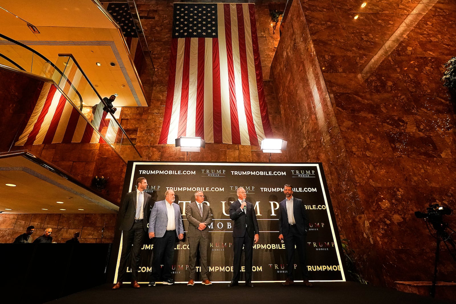 Eric Trump, Don Hendrickson, Eric Thomas, Patrick O'Brien and Donald Trump Jr., left to right, participate in the announcement of Trump Mobile, in New York's Trump Tower, Monday, June 16, 2025. (AP Photo/Richard Drew)