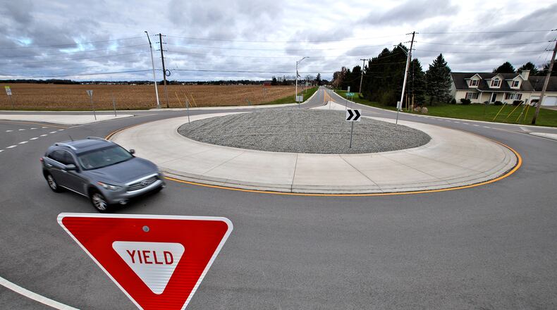 A car travels around the roundabout at the intersection of Selma Road and Possum Road Friday, April 5, 2024. Clark County is researching if more roundabouts are needed in the county and where. BILL LACKEY/STAFF