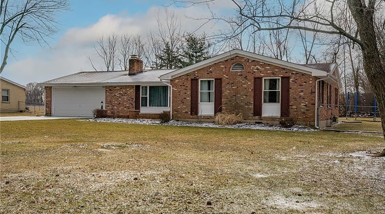 The 3-bedroom, brick ranch home offers about 2,000 sq. ft. of living space, including an addition on the rear that includes a great room and additional flex space. The home is on a .46-acre lot and includes an attached, 2-car garage and a new concrete walkway to the front door. CONTRIBUTED PHOTO