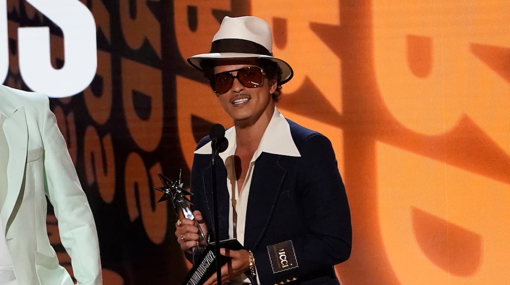 Bruno Mars accepts the award for album of the year for "An Evening with Silk Sonic" at the BET Awards on Sunday, June 26, 2022, at the Microsoft Theater in Los Angeles. (AP Photo/Chris Pizzello)