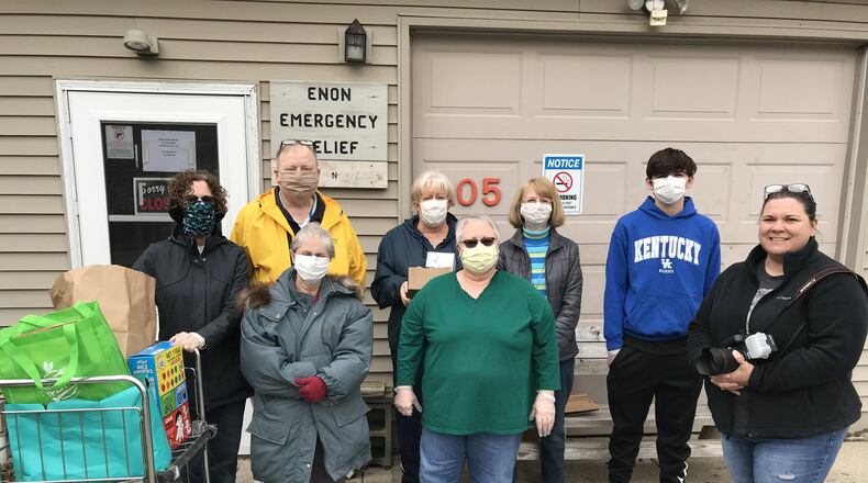 Local photographer Dawn Cox is using the popular porch photo project to raise money to help support the Enon Emergency Relief. Cox (front row, far right) is pictured with (from left, front row) Karen Olson, Lin Tranter and Pat Siler of the Enon Emergency Relief. In the back row are Dennis Hoffman, Cindy Banks, Sherry Bostick and Blaise Morris of the EER.