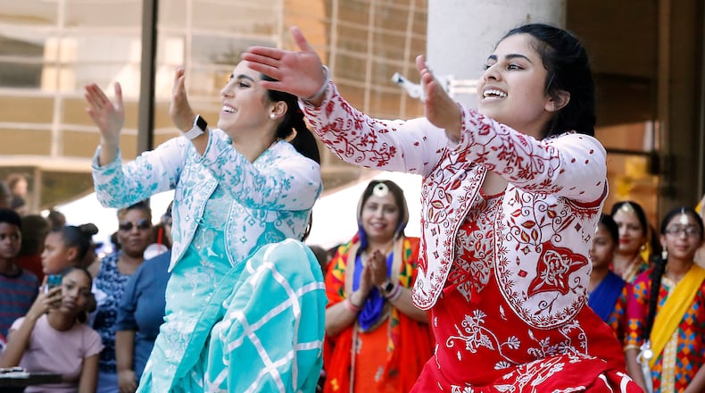 Members of Punjabi Bhangra dance group entertain the crowd with their traditional Sikh dances and clothing at CultureFest in downtown Springfield. Bill Lackey/Staff
