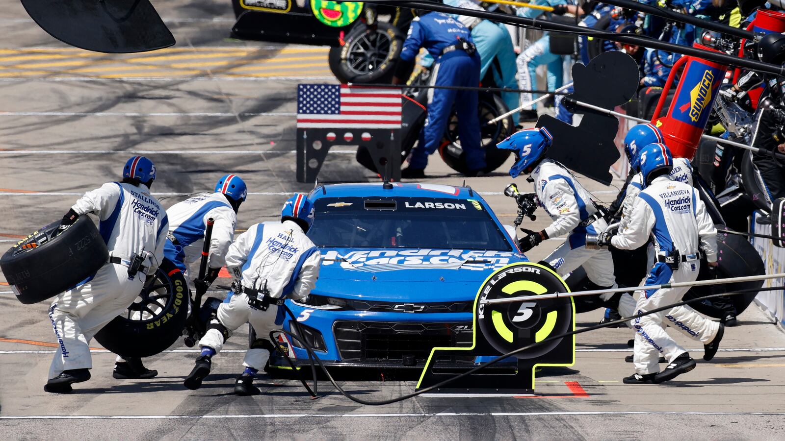 Kyle Larson gets a new set of tires during a stop on pit road in a NASCAR Cup Series auto race at Kansas Speedway in Kansas City, Kan., Sunday, May 11, 2025. (AP Photo/Colin E. Braley)
