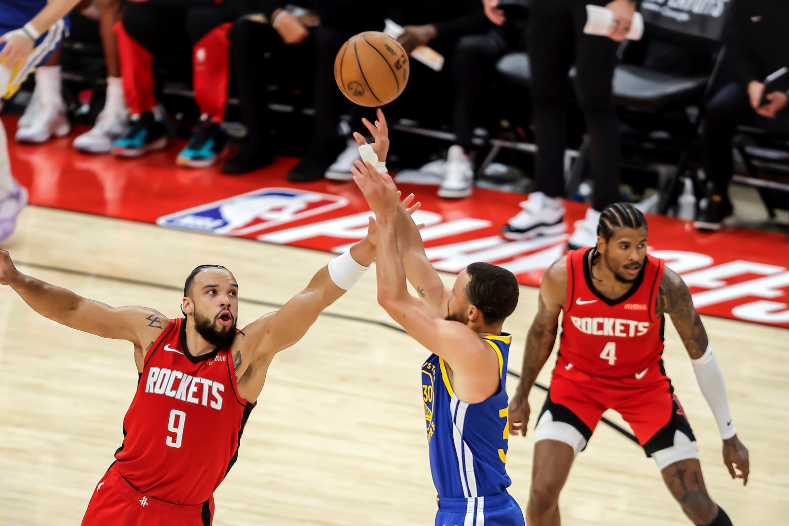 Dillon Brooks (9) goes up to defend against a 3-point shot by Stephen Curry (30) in the first half as the Golden State Warriors played the Houston Rockets in Game 5 of the First Round of the NBA Playoffs at Toyota Center in Houston, Texas on Wednesday, April 30, 2025. (Carlos Avila Gonzalez/San Francisco Chronicle via AP)