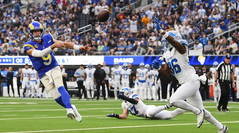 Los Angeles Rams quarterback Matthew Stafford (9) throws a pass during the first half of an NFL football game against the Detroit Lions, Sunday, Dec. 14, 2025, in Inglewood, Calif. (AP Photo/Katie Chin)