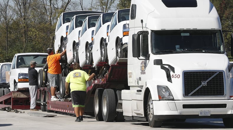 This file photo shows the loading of GM vehicles built at Navistar’s Springfield plant in 2017.  Navistar reported a net loss of $347 million during its 2020 fiscal year. Bill Lackey/Staff