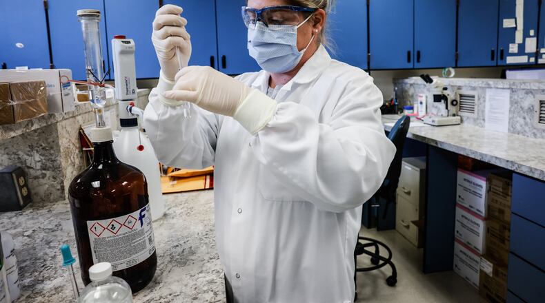 Jennifer Watson, Chemistry Tec. Leader at the Montgomery County Coroner office, extracts possible fentanyl at the lab on West Third St. in Dayton Tuesday April 12, 2022. FILE PHOTO/ STAFF
