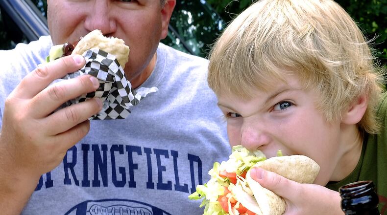 Customers enjoy gyros Saturday at the second annual Springfield Rotary Gourmet Food Truck Competition. BILL LACKEY/STAFF