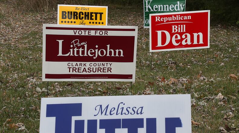 Election signs for Republican candidates decorate a yard along Enon Road. BILL LACKEY/STAFF