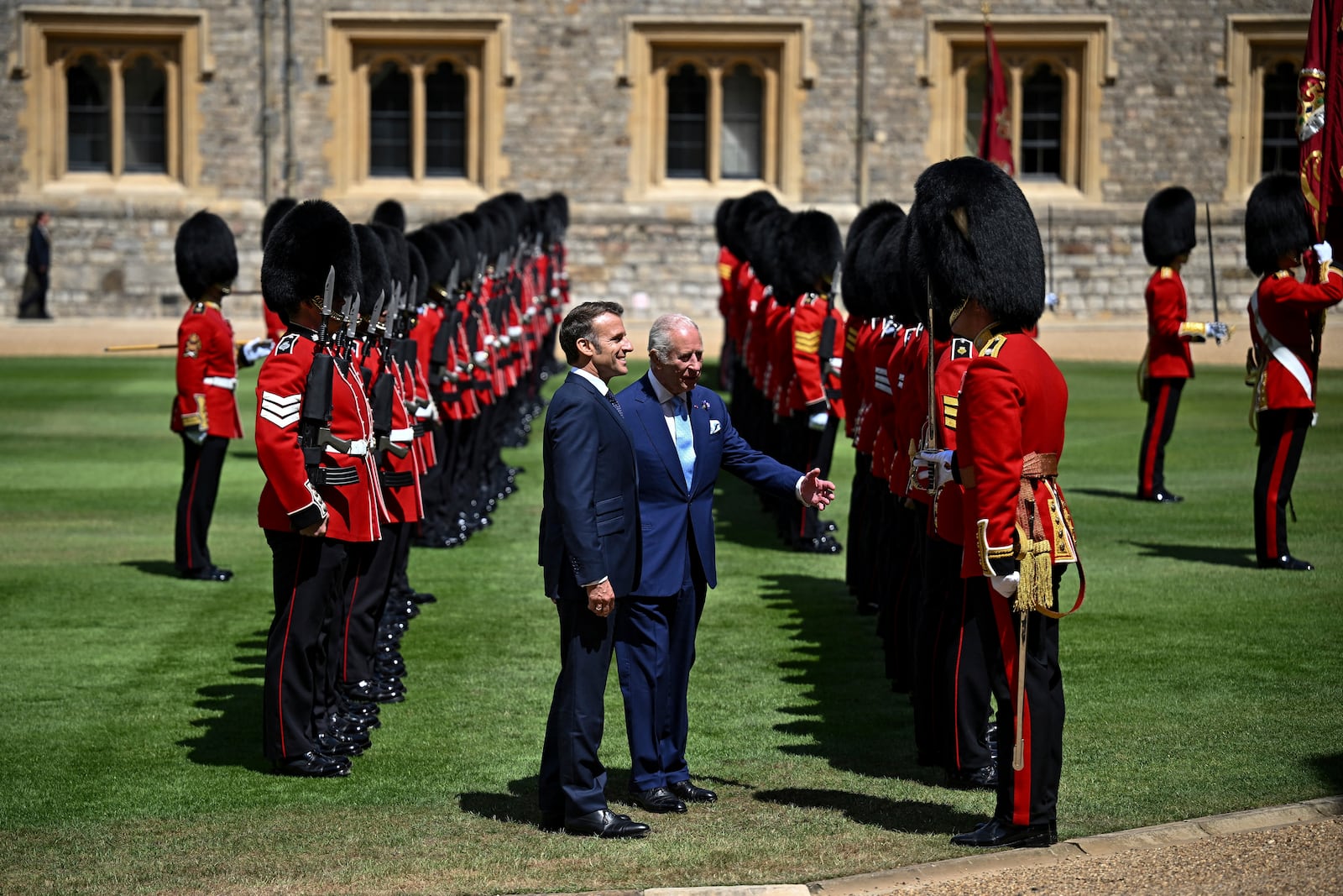 Britain's King Charles III, center right, and French President Emmanuel Macron attend a welcome ceremony at Windsor Castle, in Windsor, England, Tuesday July 8, 2025, on the first day of a three-day state visit to Britain. (Dylan Martinez/Pool via AP)