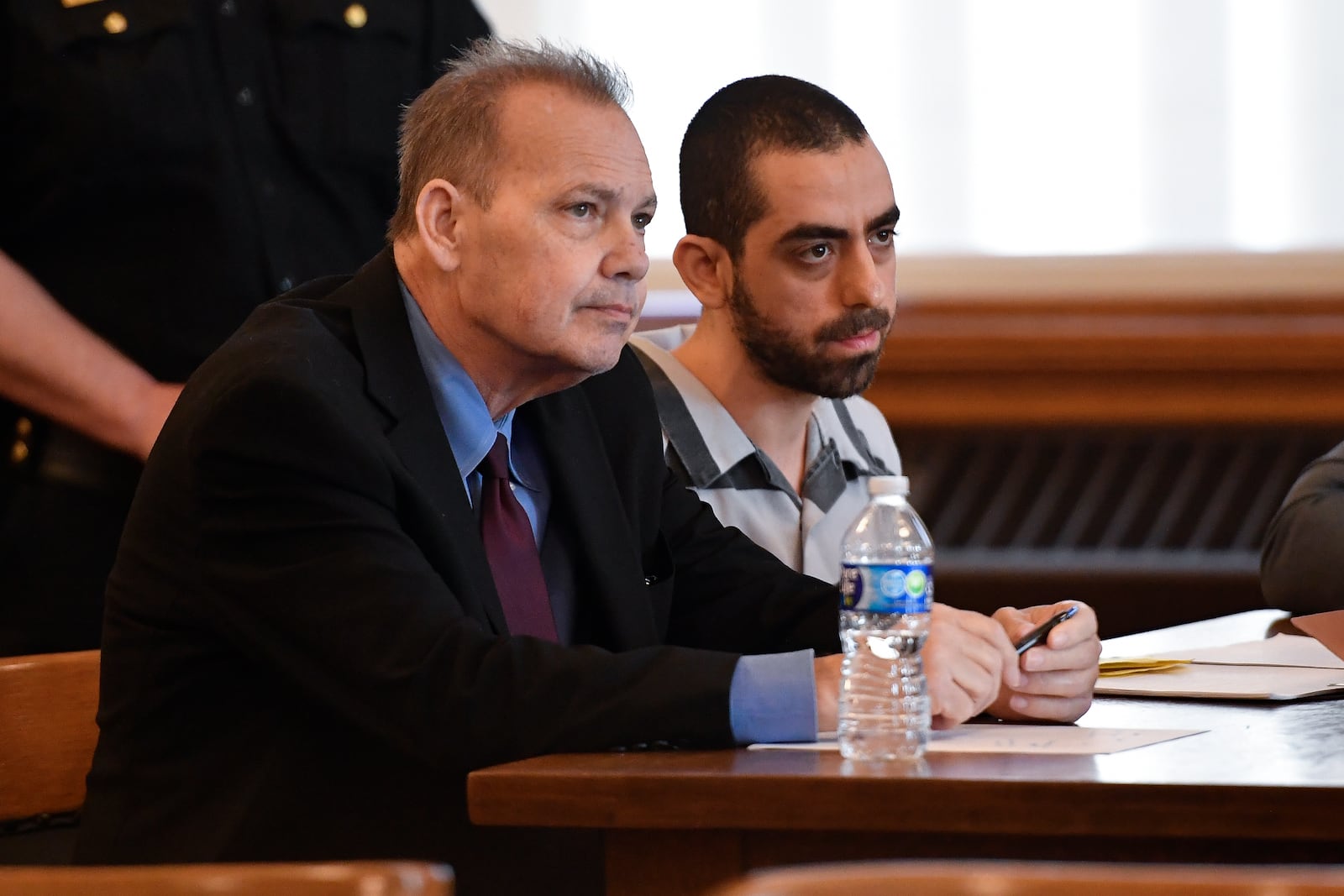 Hadi Matar, right, and public defender Nathaniel Barone listens to Chautauqua County Judge David Foley's sentence in Chautauqua County court in Mayville, N.Y., Friday, May. 16, 2025. (AP Photo/Adrian Kraus)