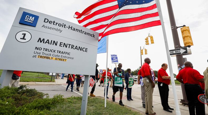 Striking United Auto Workers (UAW) union members picket at the General Motors Detroit-Hamtramck Assembly Wednesday in Detroit. (Photo by Bill Pugliano/Getty Images)