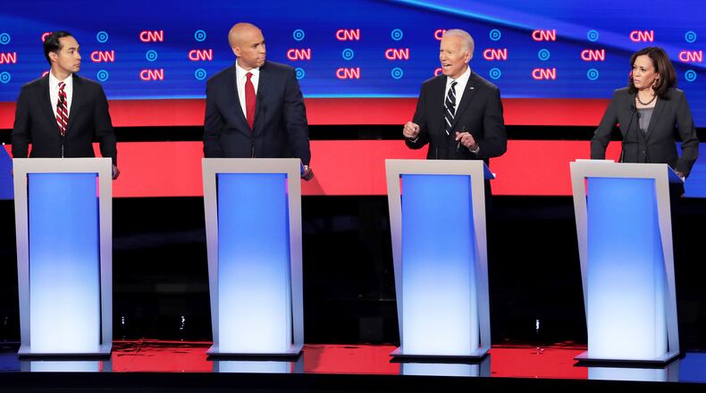 DETROIT, MICHIGAN - JULY 31:  Democratic presidential candidate former Vice President Joe Biden (2nd R)  speaks while Sen. Kamala Harris (D-CA) (R), Sen. Cory Booker (D-NJ) and former housing secretary Julian Castro listen during the Democratic Presidential Debate at the Fox Theatre July 31, 2019 in Detroit, Michigan.  20 Democratic presidential candidates were split into two groups of 10 to take part in the debate sponsored by CNN held over two nights at Detroits Fox Theatre.  (Photo by Scott Olson/Getty Images)