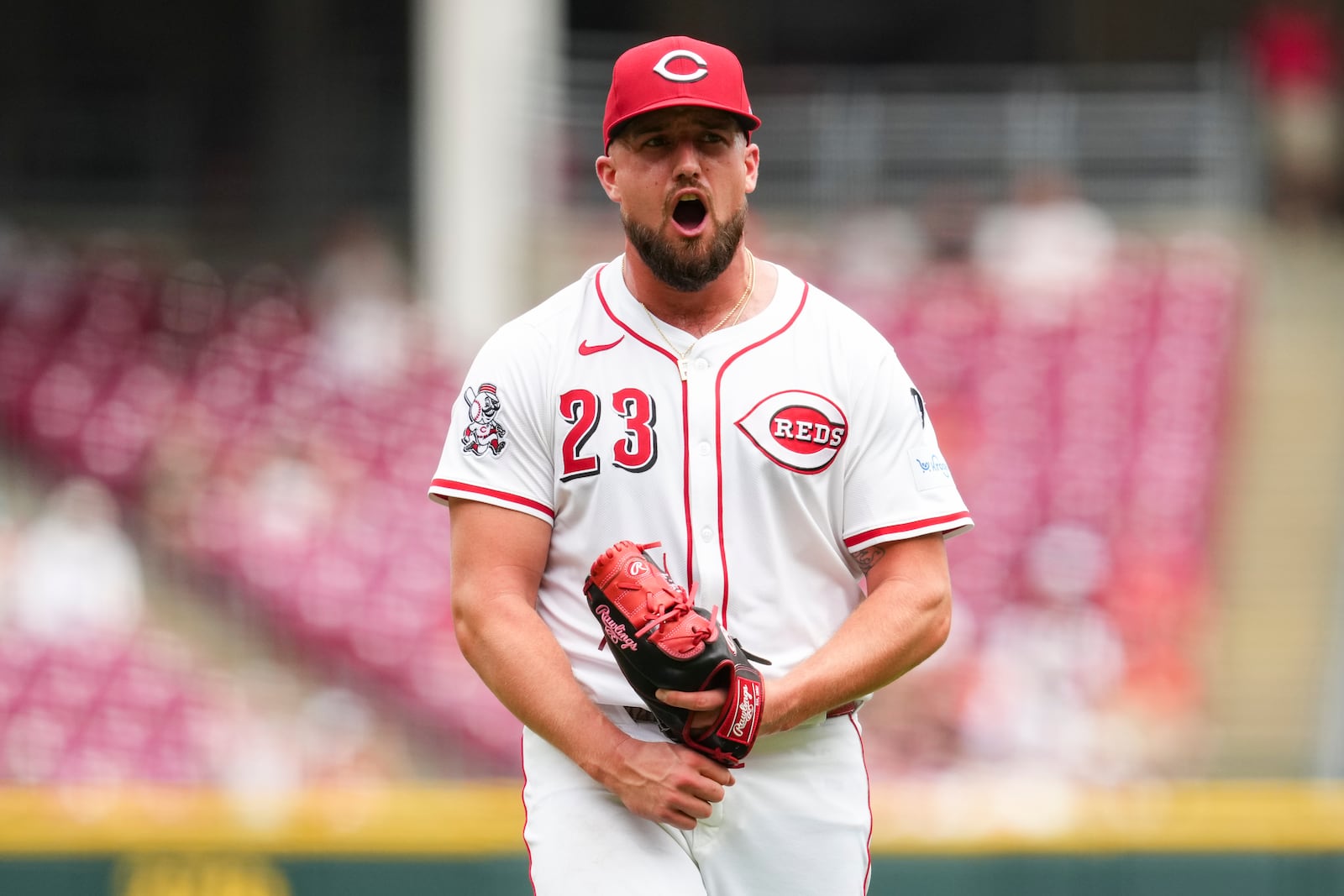 Cincinnati Reds pitcher Graham Ashcraft reacts as he walks to the dugout during the eighth inning of a baseball game against the Arizona Diamondbacks that was suspended Friday because of rain and resumed, Saturday, June 7, 2025, in Cincinnati. (AP Photo/Jeff Dean)