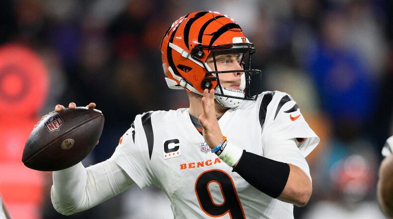 Cincinnati Bengals quarterback Joe Burrow (9) looks to pass in the first half of an NFL football game against the Baltimore Ravens in Baltimore, Thursday, Nov. 16, 2023. (AP Photo/Nick Wass)