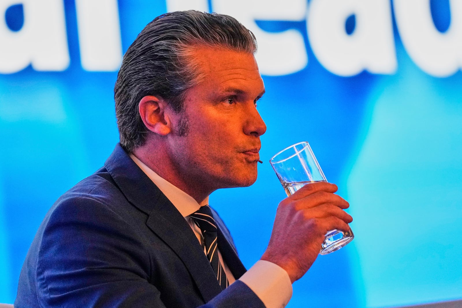 U.S. Defense Secretary Pete Hegseth drinks water during 22nd Shangri-La Dialogue summit in Singapore,Saturday, May 31, 2025. (AP Photo/Anupam Nath)