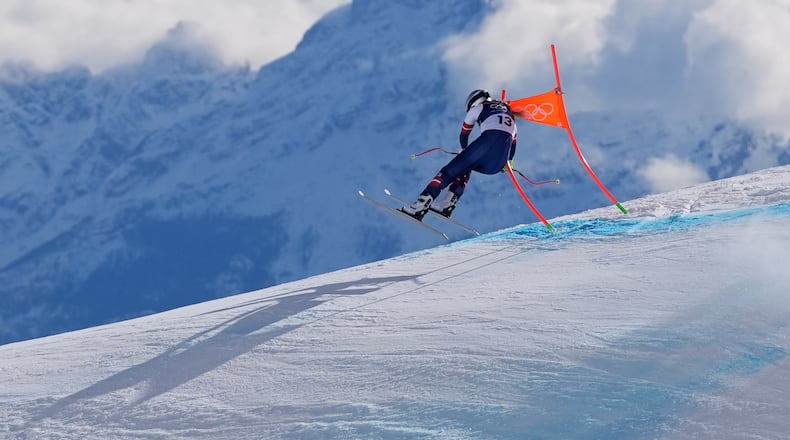 United States' Lindsey Vonn crashes into a gate during an alpine ski women's downhill race, at the 2026 Winter Olympics, in Cortina d'Ampezzo, Italy, Feb. 8, 2026. (AP Photo/Jacquelyn Martin, File)