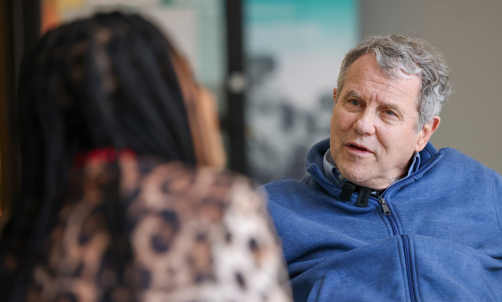 Former Sen. Sherrod Brown (right) listens to a local entrepreneur in the Dayton Arcade on Wednesday, Feb. 11. BRYANT BILLING / STAFF