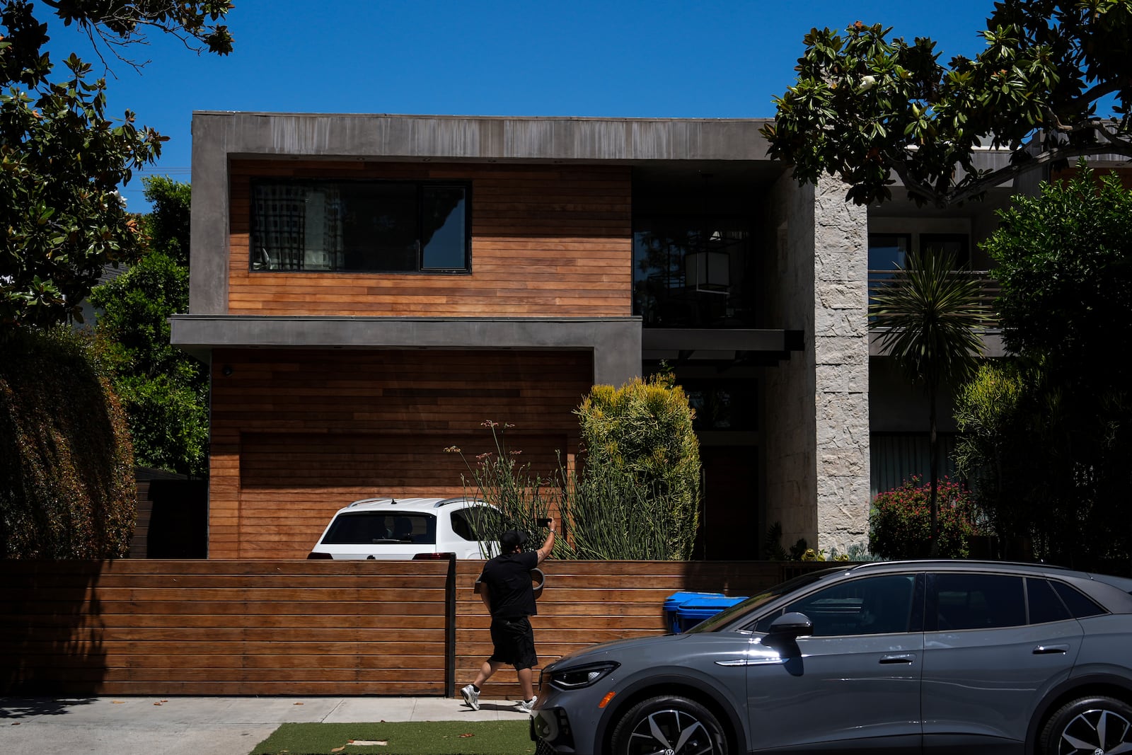 A person records the residency of Mexican boxer Julio César Chávez Jr., Thursday, July 3, 2025, in Los Angeles. (AP Photo/Jae C. Hong)