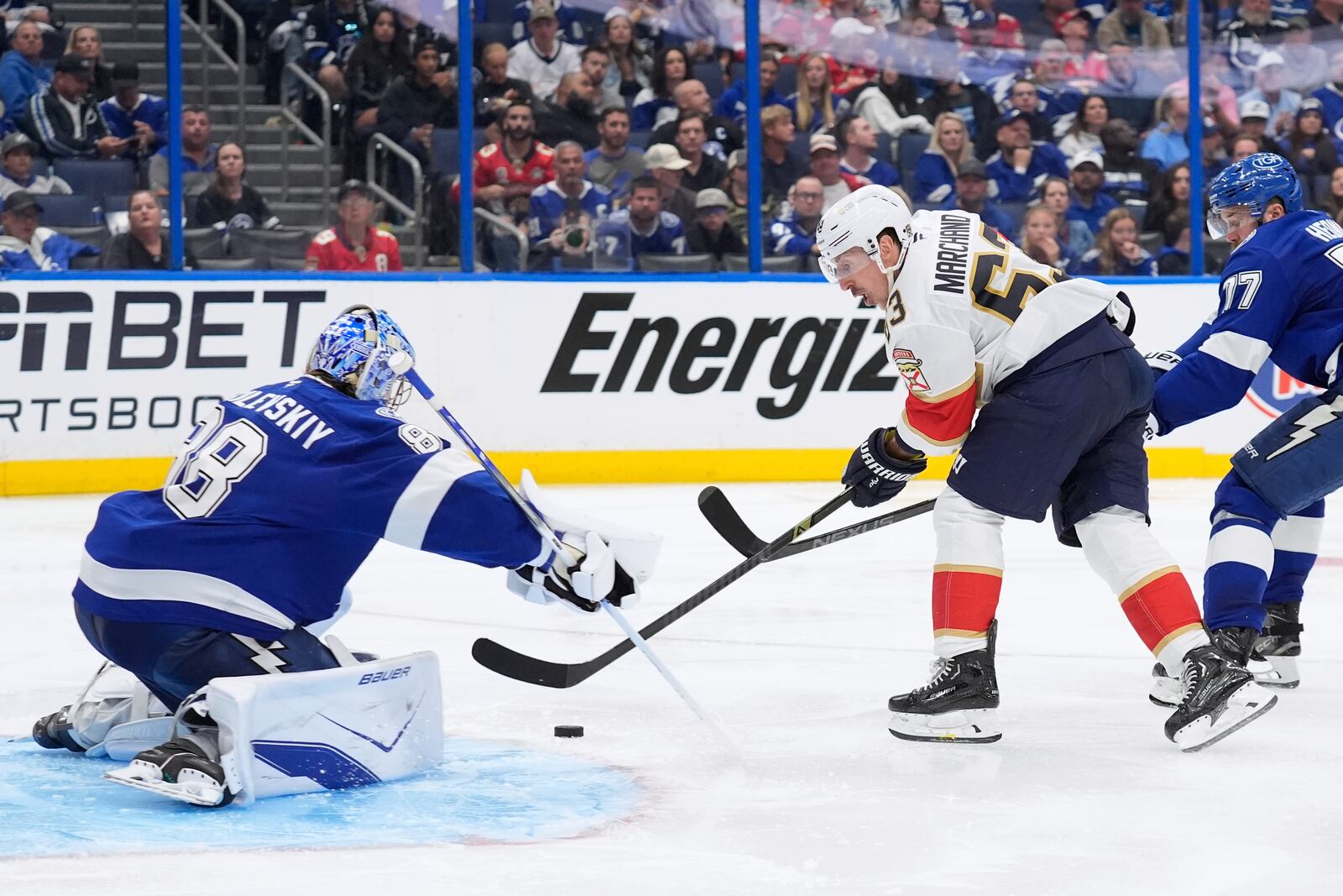 Florida Panthers center Brad Marchand (63) shoots on Tampa Bay Lightning goaltender Andrei Vasilevskiy during the third period in Game 1 of an NHL hockey Stanley Cup first-round playoff series, Tuesday, April 22, 2025, in Tampa, Fla. (AP Photo/Chris O'Meara)