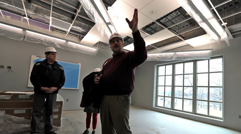 Urbana Schools superintendent Charles Thiel lead a tour of the new Urbana High School which is scheduled to open after spring break. Bill Lackey/Staff