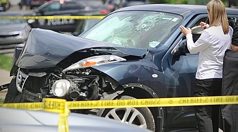 Springfield Police are investigating a crash and shooting near South Limestone Street and Euclid Avenue on Wednesday, May 14, 2025. MARSHALL GORBY/CONTRIBUTED