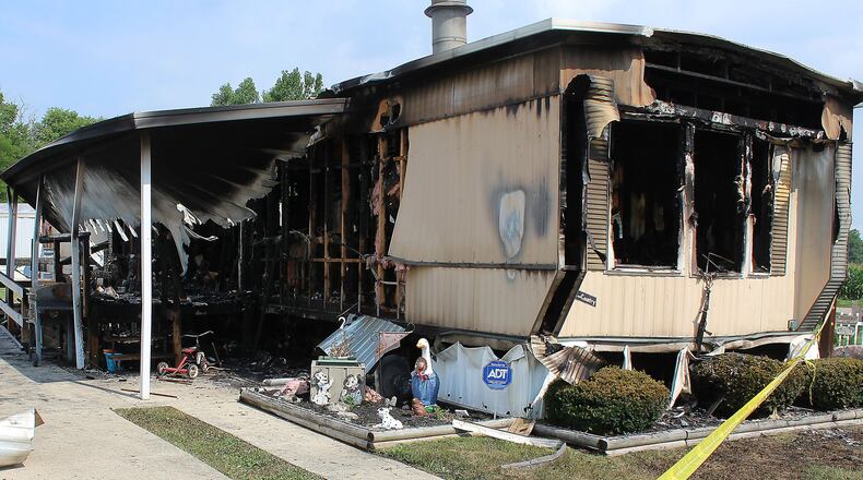 Police tape surrounds the scene of a fatal fire in German Twp., Clark County, in which 70-year-old Dorris Rehs died in July, 2016. JEFF GUERINI/STAFF