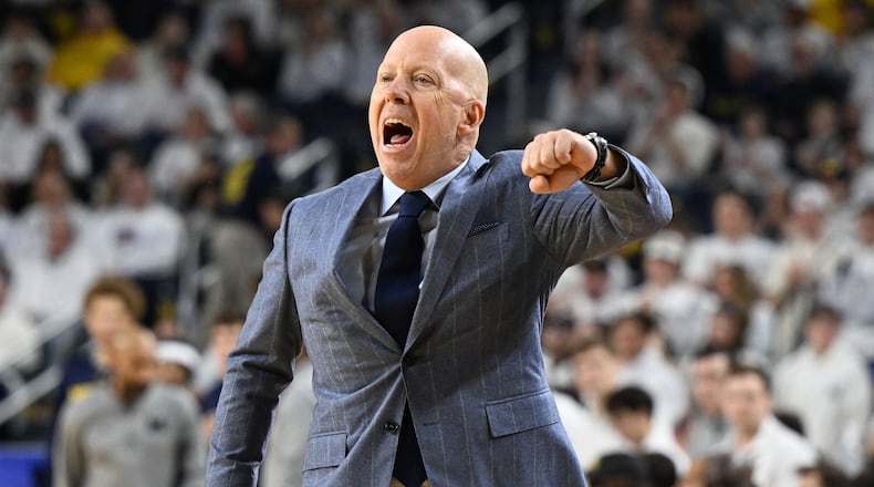 UCLA head coach Mick Cronin argues with a referee during the first half of an NCAA college basketball game against Michigan in Ann Arbor, Mich., Saturday, Feb. 14, 2026. (AP Photo/Lon Horwedel)