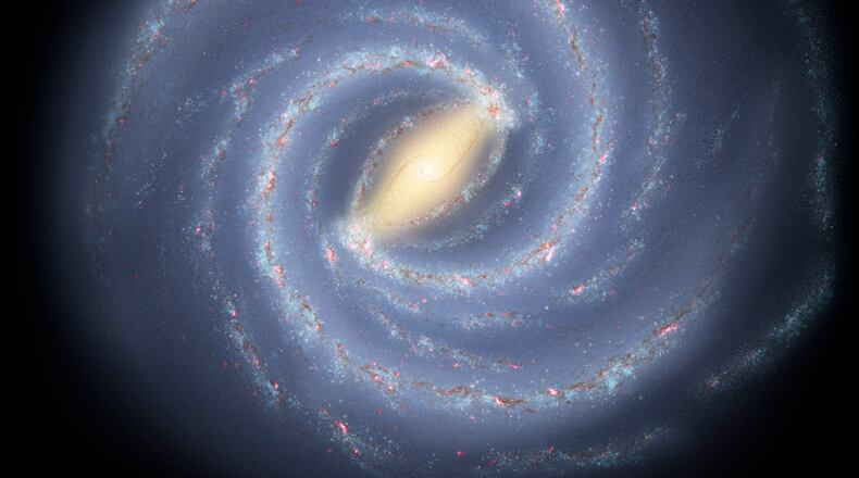 Like early explorers mapping the continents of our globe, astronomers are busy charting the spiral structure of our galaxy, the Milky Way. Using infrared images from NASA's Spitzer Space Telescope, scientists have discovered that the Milky Way's elegant spiral structure is dominated by just two arms wrapping off the ends of a central bar of stars. Previously, our galaxy was thought to possess four major arms. PHOTO COURTESY OF NASA